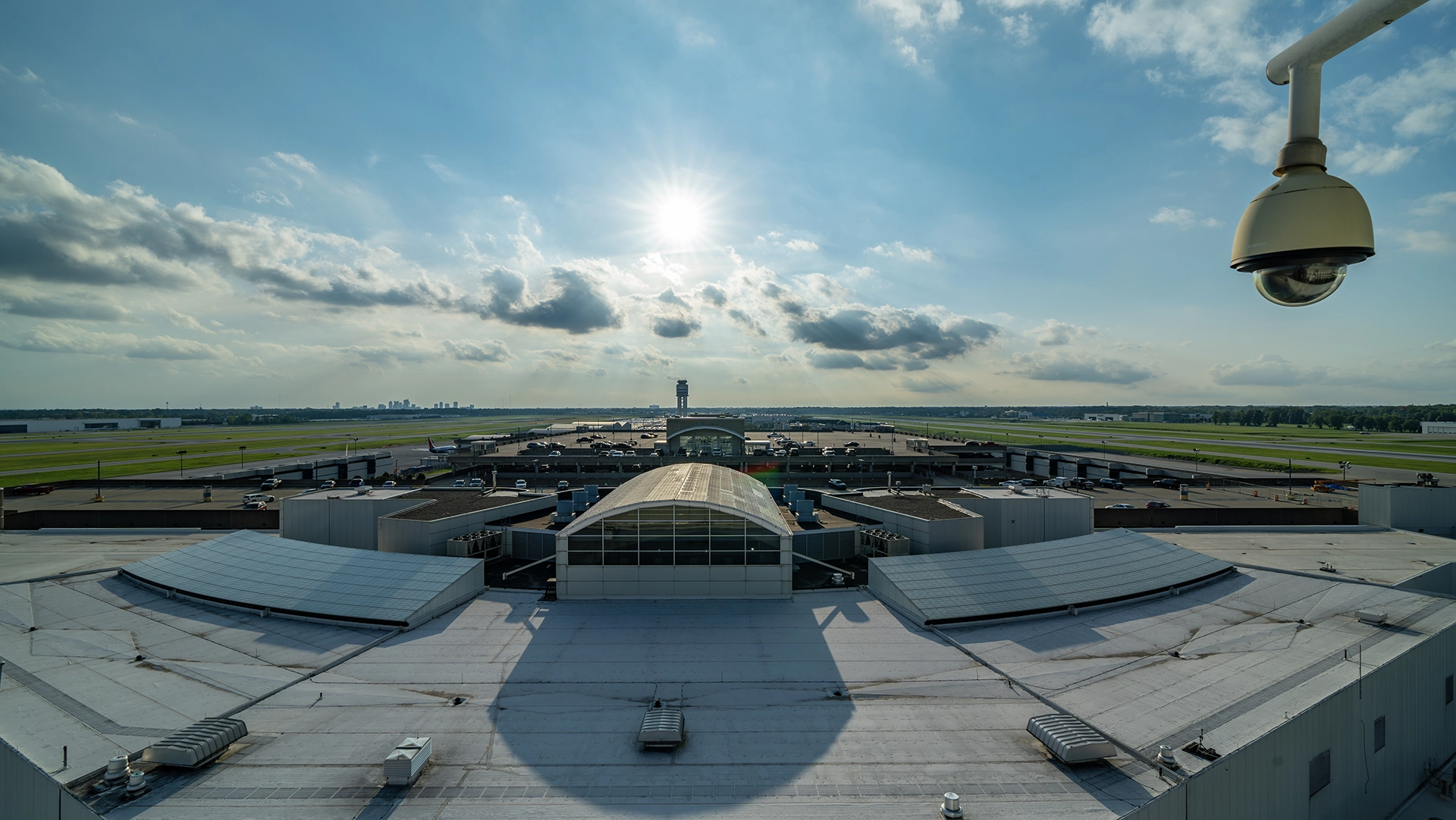 Business 1 A security camera is installed on top of a building belonging to the Columbus Regional Airport Authority (CRAA).