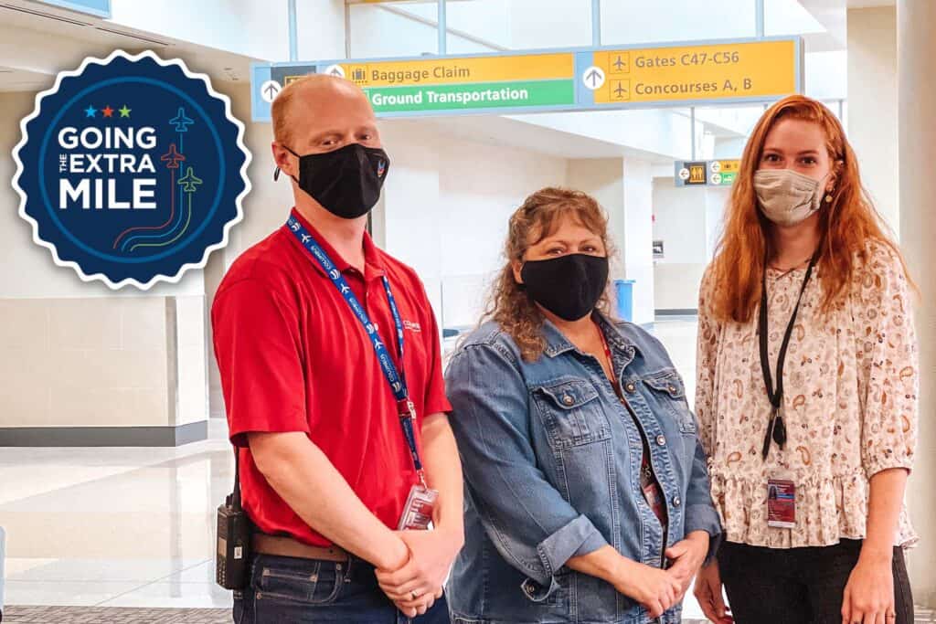 Portrait of CRAA staff Danny, Donna and Victoria wearing masks in the CMH terminal building