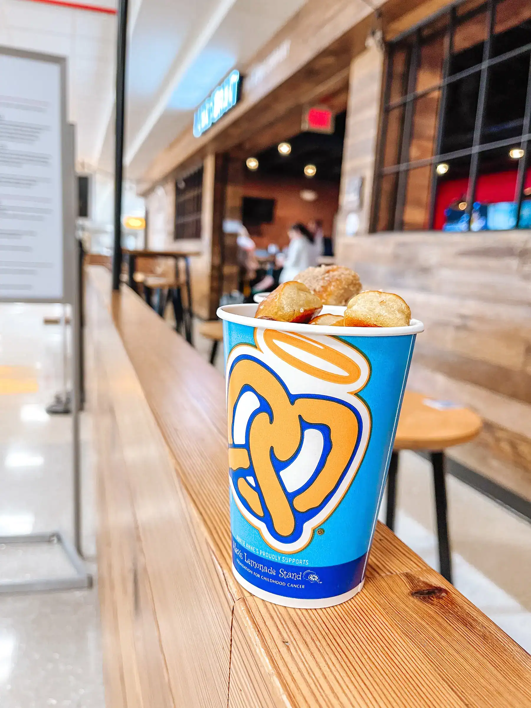Auntie Annes, cup of pretzel bites in the John Glenn International Airport terminal