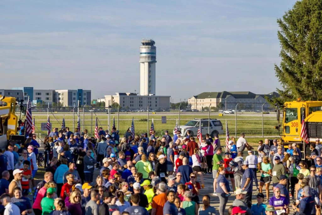 Large group of people standing on the ramp during the 5k runway event at CMH
