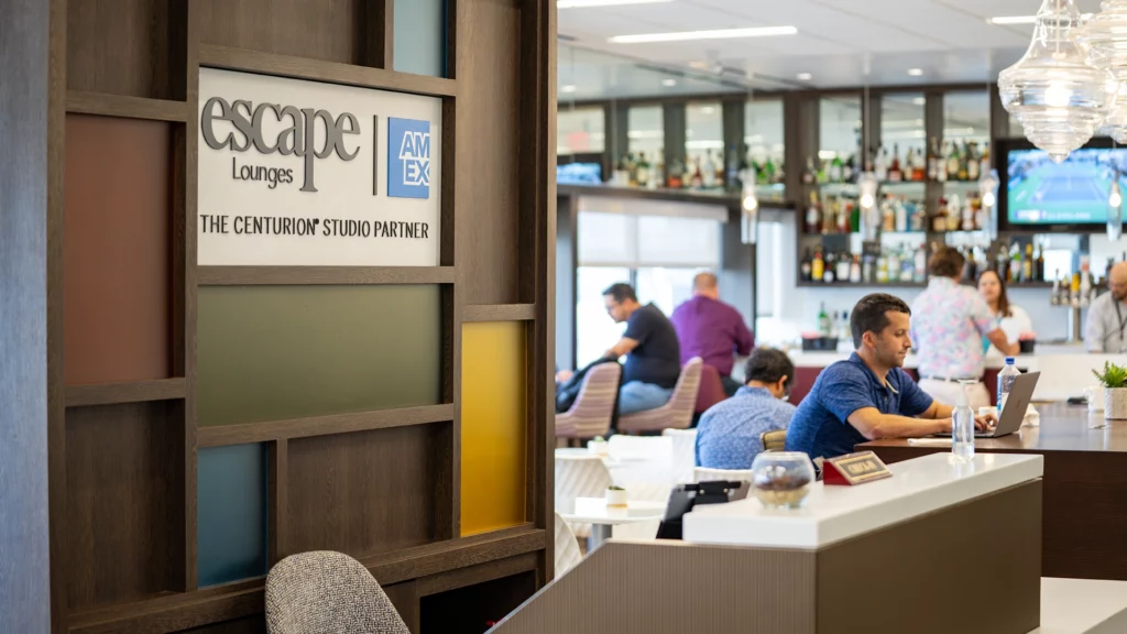 Travelers enjoying the AMEX Escape Lounge at CMH Airport.