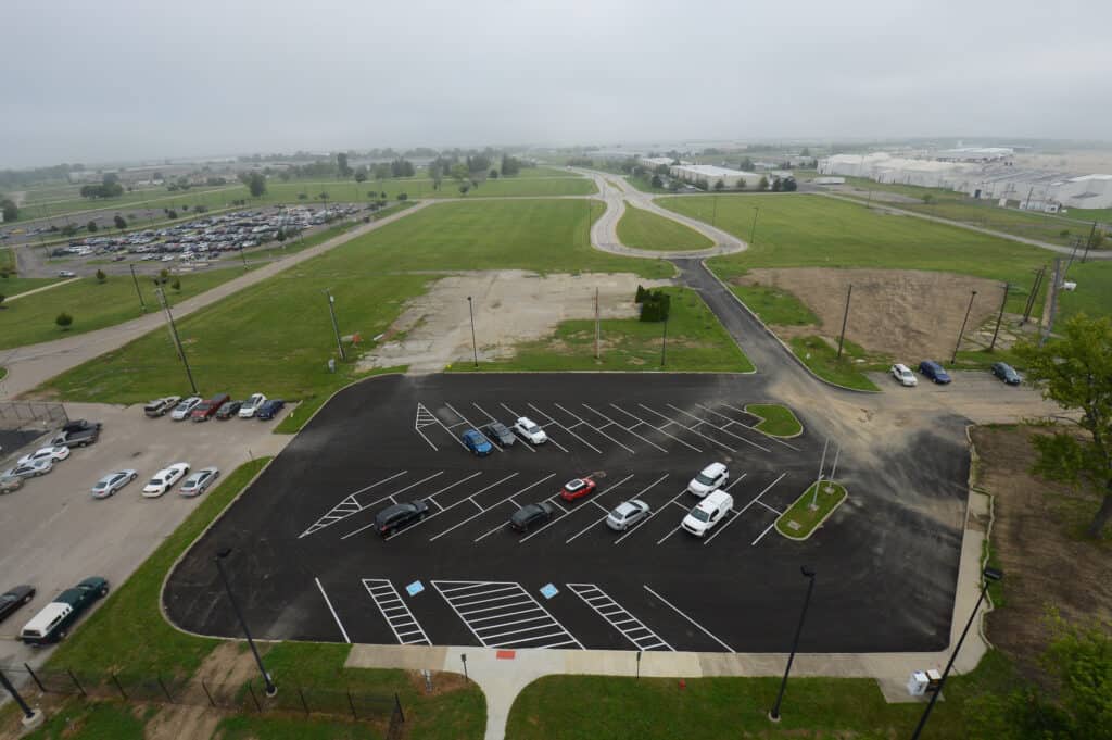 An aerial view of a parking lot with cars parked in it at Columbus Regional Airport Authority.