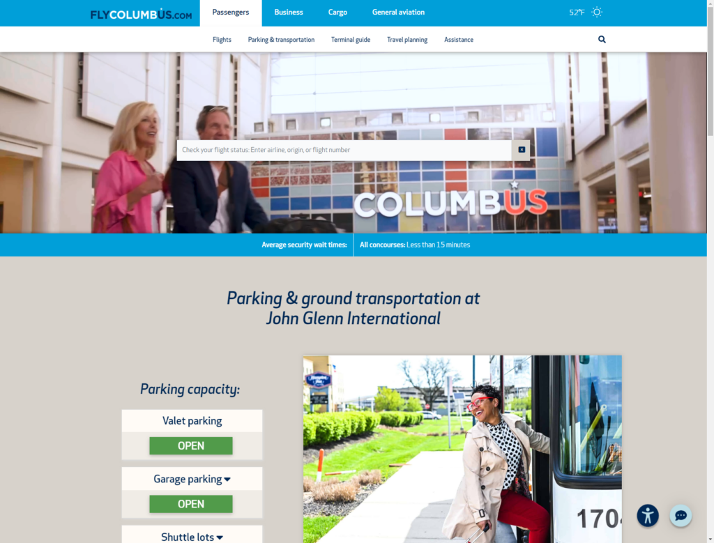 Screenshot of the homepage for FlyColumbus.com. It has a flight status search bar over top of a photo of a man carrying a guitar while riding an escalator.