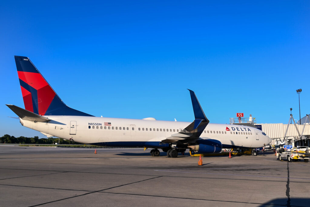 Delta Air Lines Boeing 737 sits on the ramp at a gate.