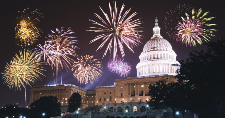Golden yellow, red, orange, and green fireworks light up the sky over the Capital building in Washington D.C.