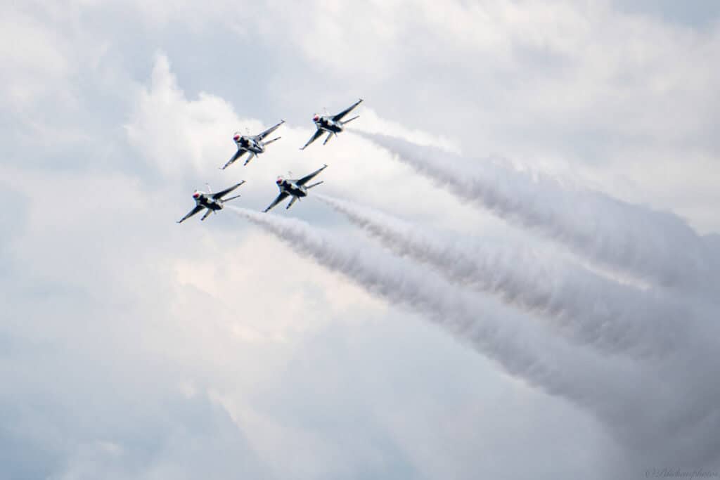 Four United States Thunderbirds aircraft fly in formation in the sky above Columbus, Ohio.